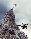 Businessman climbing mountain Royalty Free Stock Photo