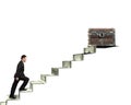 Businessman climbing spiral staircase toward treasure chest on m Royalty Free Stock Photo