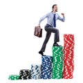 Businessman climbing stacks of chips Royalty Free Stock Photo