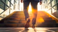 Businessman climbing stairs with sunlight ahead. Business person, professional-looking entrepreneur with legs and shoes close up Royalty Free Stock Photo