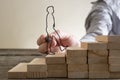 Businessman climbing steps of wooden blocks