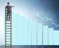 Businessman climbing towards growth in statistics Royalty Free Stock Photo