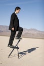 Businessman climbing up