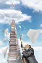 Businessman climbing up the pile of paperwork Royalty Free Stock Photo