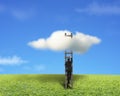 Businessman climbing on wooden ladder to reach cloud Royalty Free Stock Photo