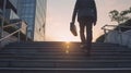 businessman climbs illuminated stairs amidst the sunset skyscrapers of a contemporary urban setting at dusk.