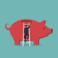 Businessman climbs stairs to big piggy bank Royalty Free Stock Photo