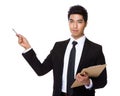 Businessman with clipboard and pen point up Royalty Free Stock Photo