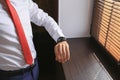 Businessman clock clothes, businessman checking time on his wristwatch. Royalty Free Stock Photo