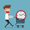 Businessman with clock in shopping cart . Buy time concept. Royalty Free Stock Photo