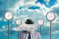 Businessman with a cloud instead of a head. Street clock, and clouds on the background. Creative thinking concept. Quick ideas. Royalty Free Stock Photo