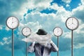 Businessman with a cloud instead of a head. Street clock, and clouds on the background. Creative thinking concept. Quick Royalty Free Stock Photo