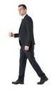 Businessman with coffee walking, isolated over white background Royalty Free Stock Photo