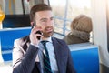 Businessman commuter is traveling and is talking Royalty Free Stock Photo