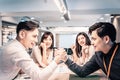 Businessman Competing In Arm Wrestling at office