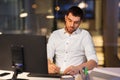 Businessman with computer working at night office Royalty Free Stock Photo