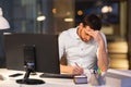 Businessman with computer working at night office Royalty Free Stock Photo