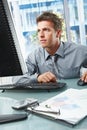 Businessman concentrating on work in office