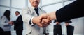 Businessman confidently shaking hands with his business partner. Royalty Free Stock Photo