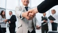 Businessman confidently shaking hands with his business partner. Royalty Free Stock Photo