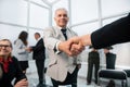 Businessman confidently shaking hands with his business partner. Royalty Free Stock Photo