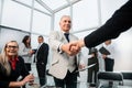 Businessman confidently shaking hands with his business partner. Royalty Free Stock Photo