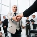 Businessman confidently shaking hands with his business partner. Royalty Free Stock Photo