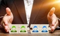 Businessman connects puzzles of workers employees in one group. Creation of an effective team of specialists Royalty Free Stock Photo