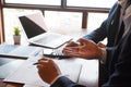 Businessman consulting, reviewing document together in office