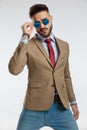 Businessman with cool style against gray studio background Royalty Free Stock Photo