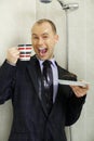 Businessman cooling down under a shower Royalty Free Stock Photo