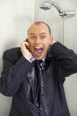 Businessman cooling down under a shower