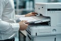 Businessman in Corporate Office Using Multifunction Laser Printer to Print Important Documents Concept Highlighting Ink Royalty Free Stock Photo