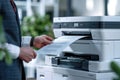 Businessman in Corporate Office Using Multifunction Laser Printer to Print Important Documents Concept Highlighting Ink Royalty Free Stock Photo