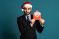 Businessman in corporate suit with tie holding dollars money envelope