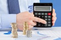 Businessman counting coins Royalty Free Stock Photo