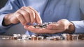 Businessman counting coins on the desk Royalty Free Stock Photo