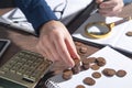 Businessman counting coins on the desk Royalty Free Stock Photo