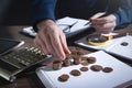 Businessman counting coins on the desk Royalty Free Stock Photo