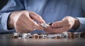 Businessman counting coins on the desk Royalty Free Stock Photo