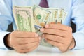 Businessman counting money,US dollar (USD) bills