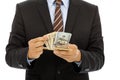 Businessman counting us dollars with white background.