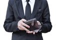 businessman counts the income or salary on leather wallet