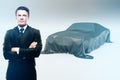 Businessman and covered car Royalty Free Stock Photo