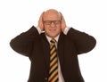 Businessman covering ears