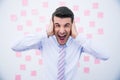 Businessman covering his ears and shouting Royalty Free Stock Photo