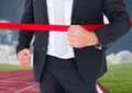 Businessman crossing finish line during race Royalty Free Stock Photo