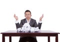 Businessman with crumpled papers on his desk