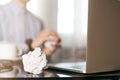 Businessman crumpling paper on his workplace.Office workplace with crumpled paper balls on the table