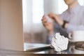 Businessman crumpling paper on his workplace.Office workplace with crumpled paper balls on the table Royalty Free Stock Photo